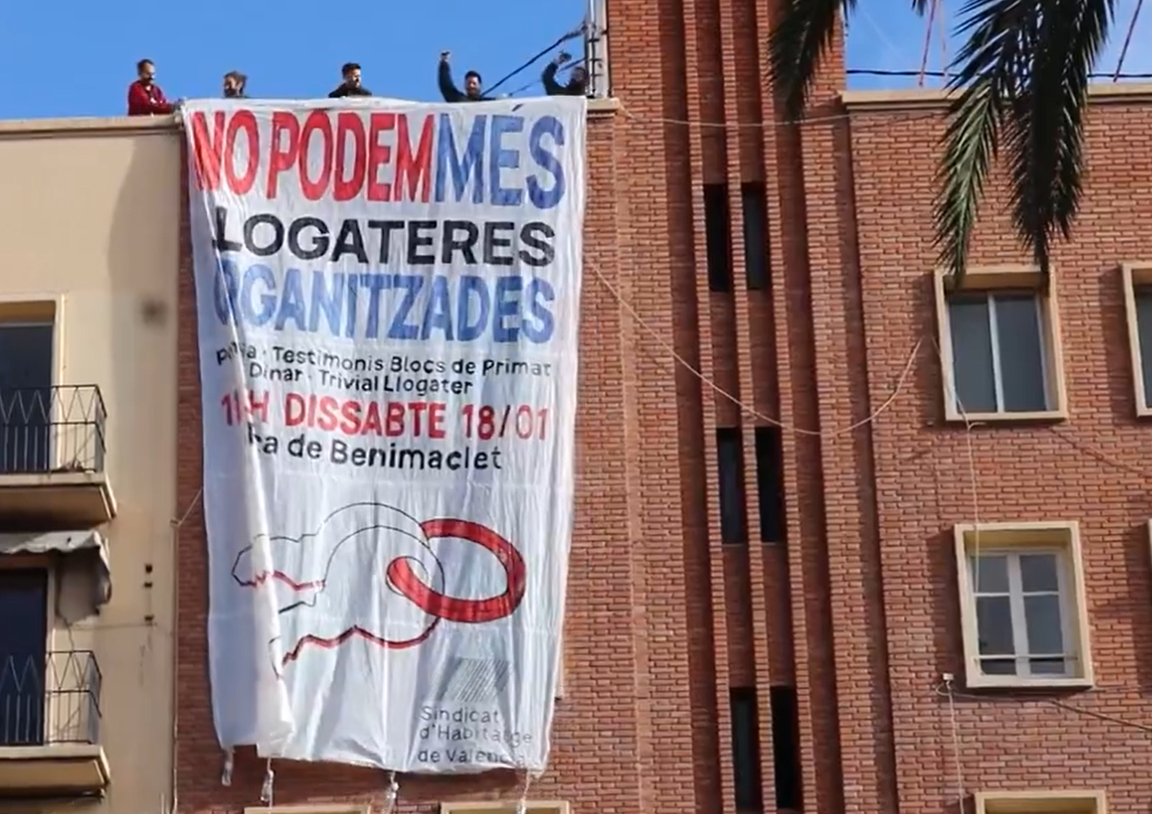 Pancarta als blocs de Primat Reig amenaçats d'expulsió en suport a l'acte de demà